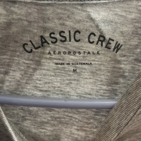 Never used, size M plain gray with a black design on the shirt. - Picture 2 of 3